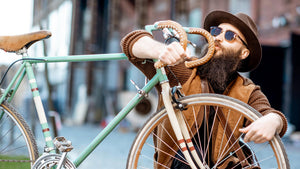 Man Looking at handlebar of his electric bike